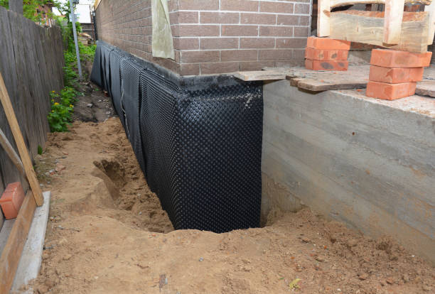Happy homeowners after waterproofing job in Cunningham